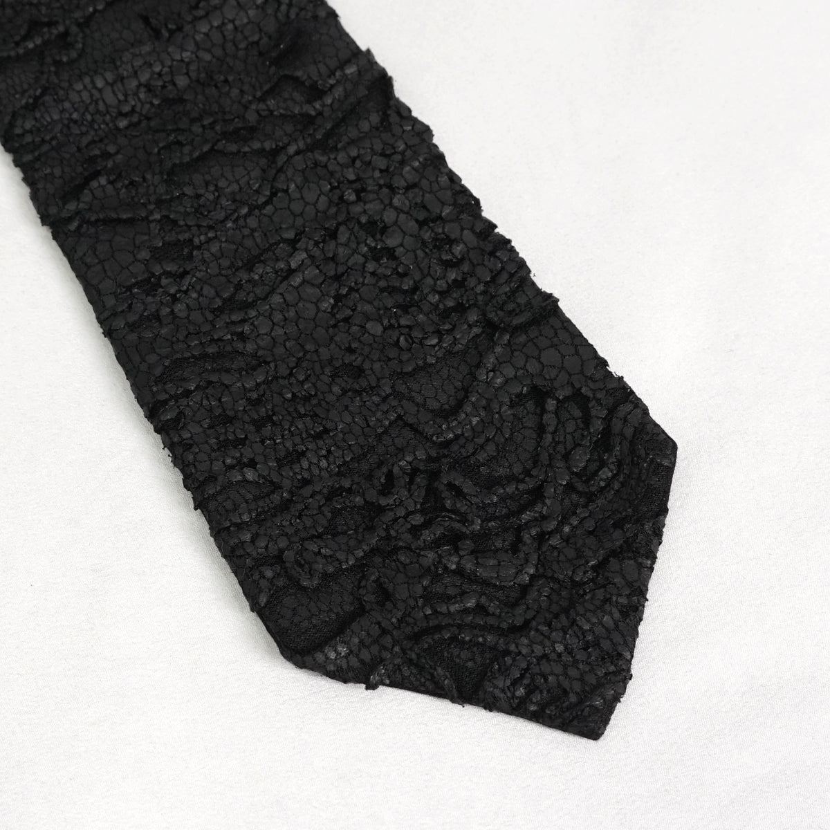 Devil Fashion AS157 mens black dark punk tie close-up showing the coated fabric with worn scale pattern.