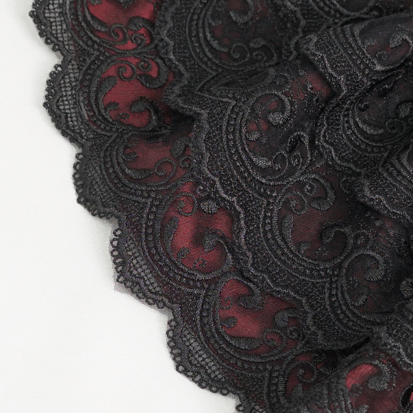 Devil Fashion AS144 burgundy black gothic jabot close-up focusing on the oval metal frame with black stone.