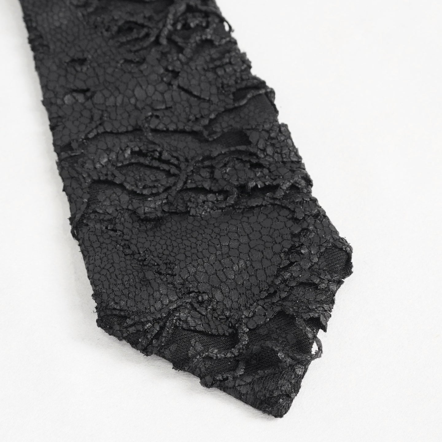 Devil Fashion AS148 womens black dark punk tie close-up showing the coated fabric with worn scale pattern.