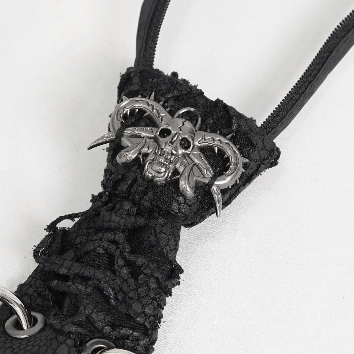Devil Fashion AS148 womens black dark punk tie close-up focusing on the silver metal devil skull ornament.