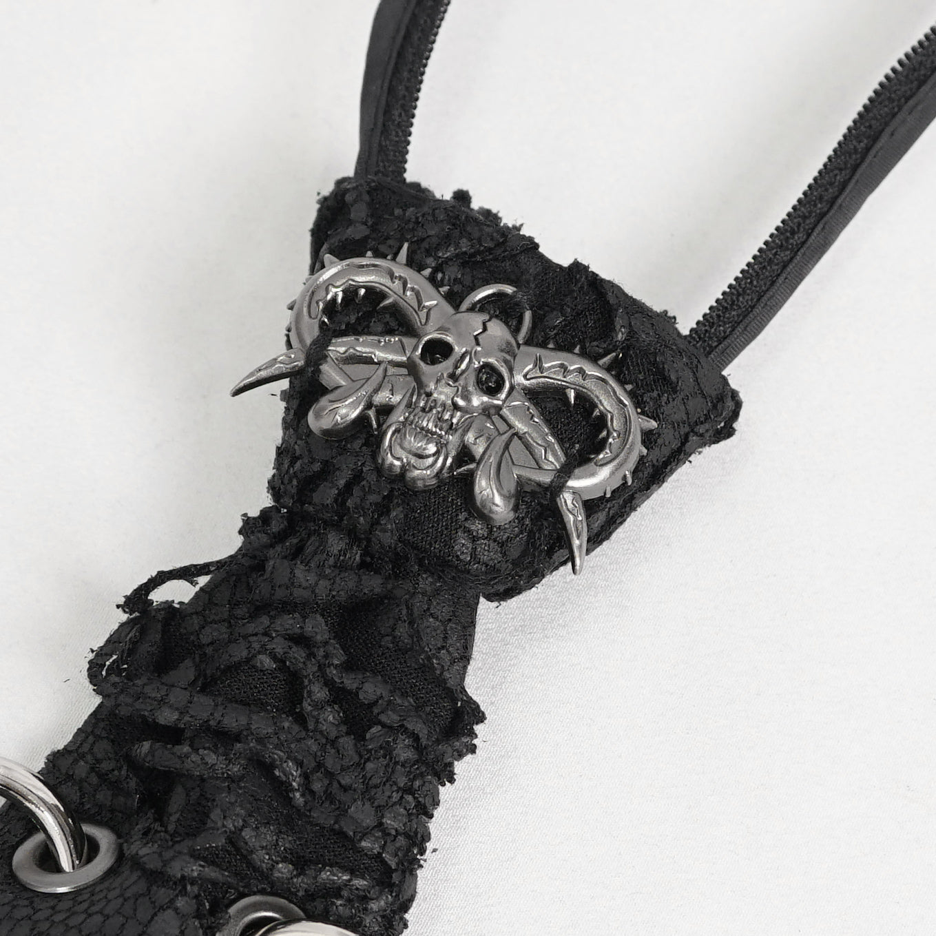 Devil Fashion AS148 womens black dark punk tie close-up focusing on the silver metal devil skull ornament.