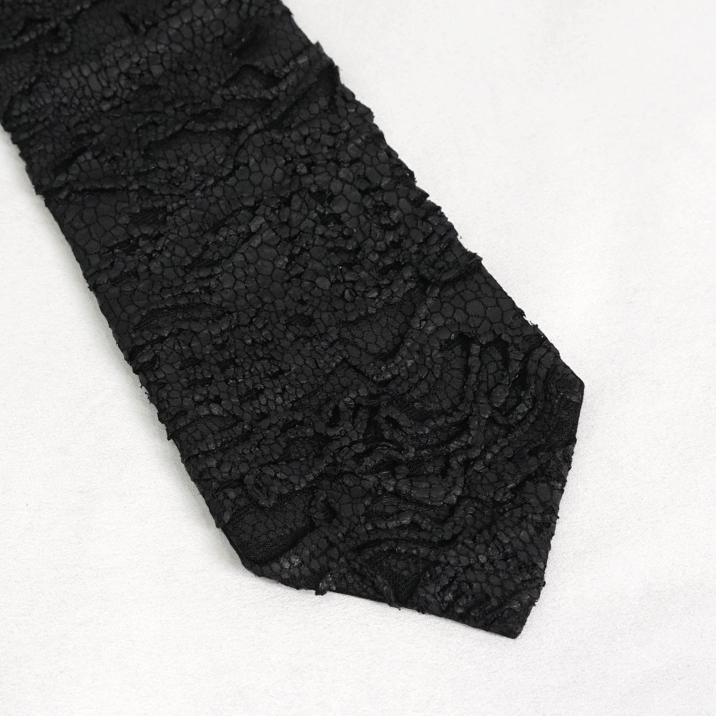 Devil Fashion AS157 mens black dark punk tie close-up showing the coated fabric with worn scale pattern.