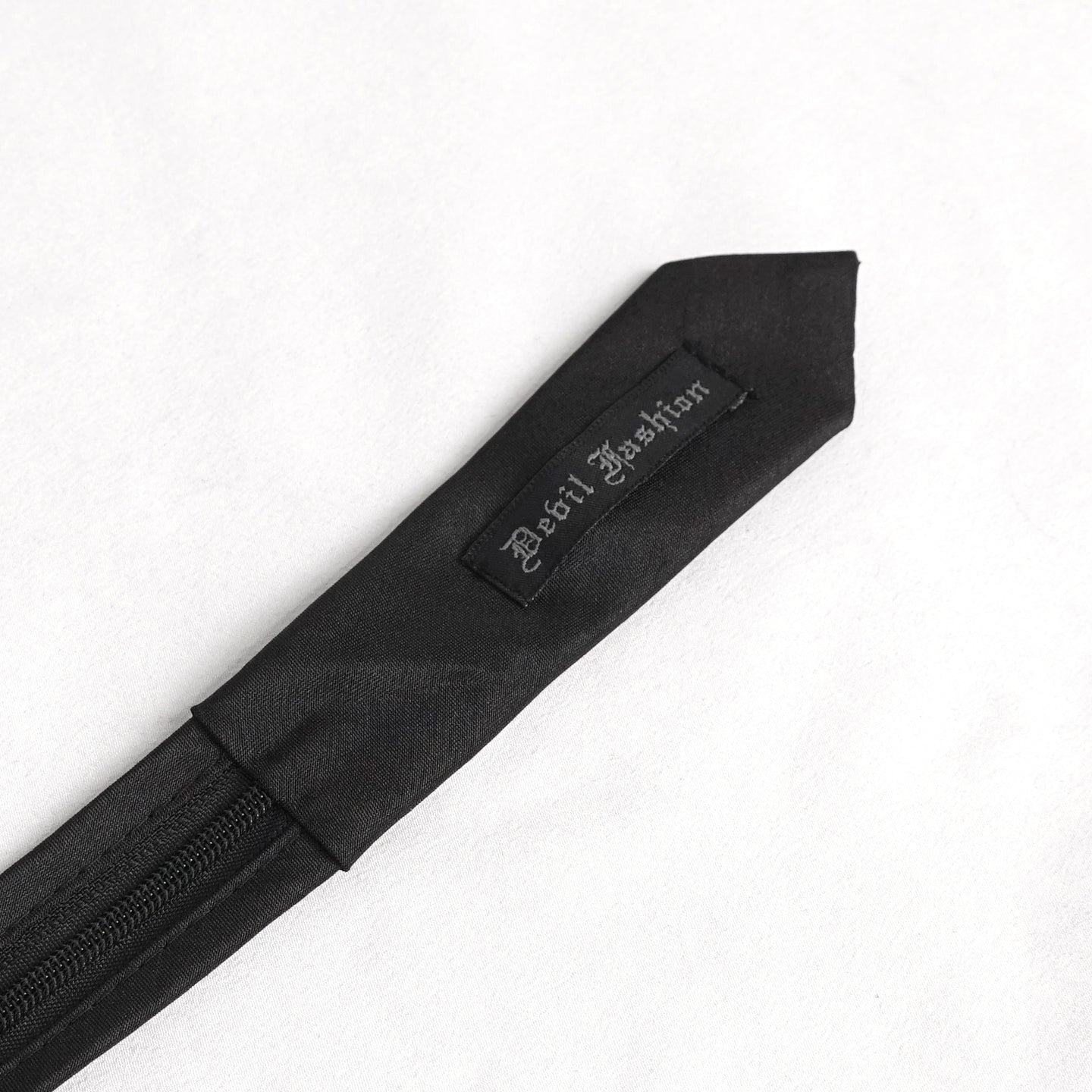 Devil Fashion AS157 mens black dark punk tie back view showing the branded fabric lining and product label.