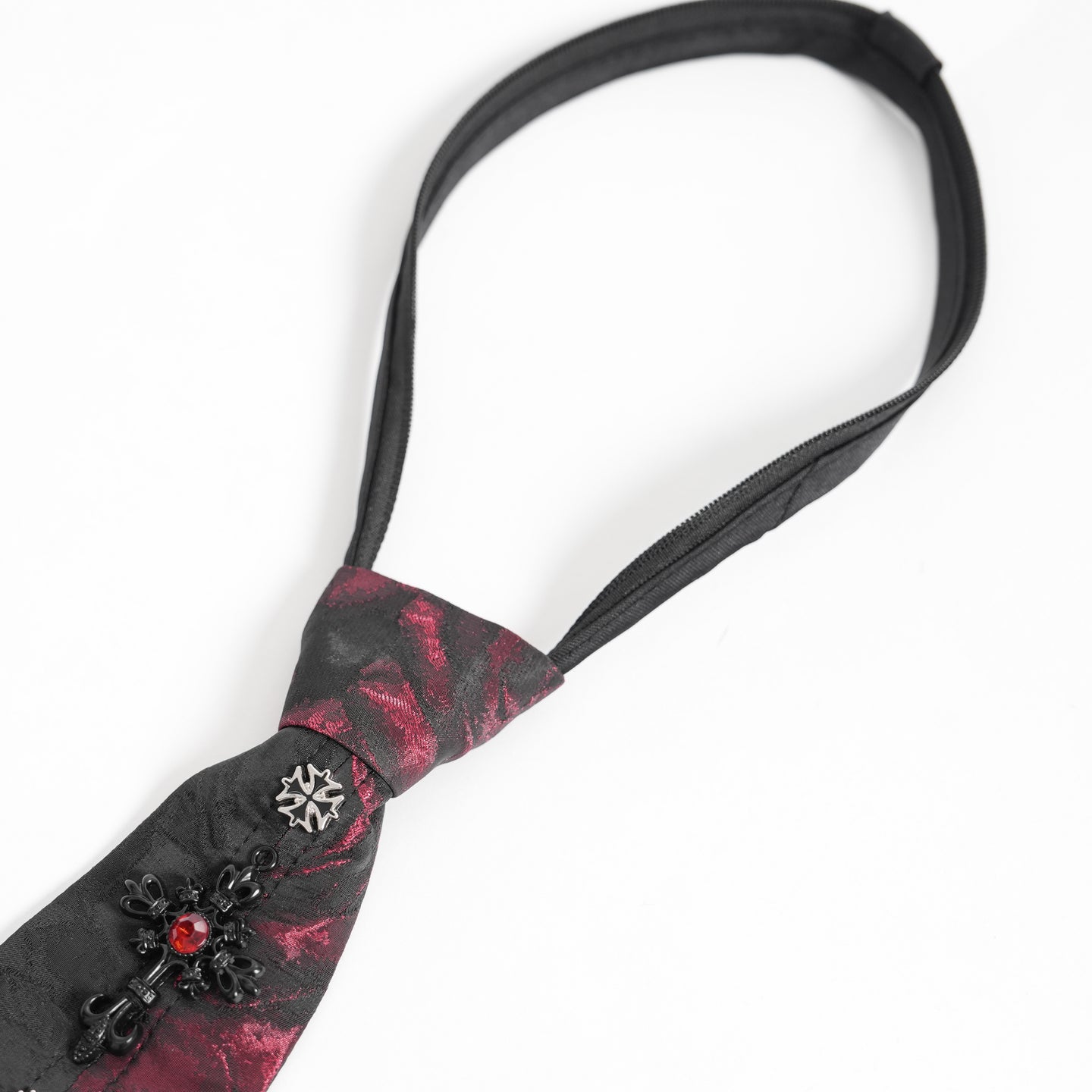 Devil Fashion AS213 gothic necktie close-up view showing the pre-tied knot, a cross and the textured brocade fabric.