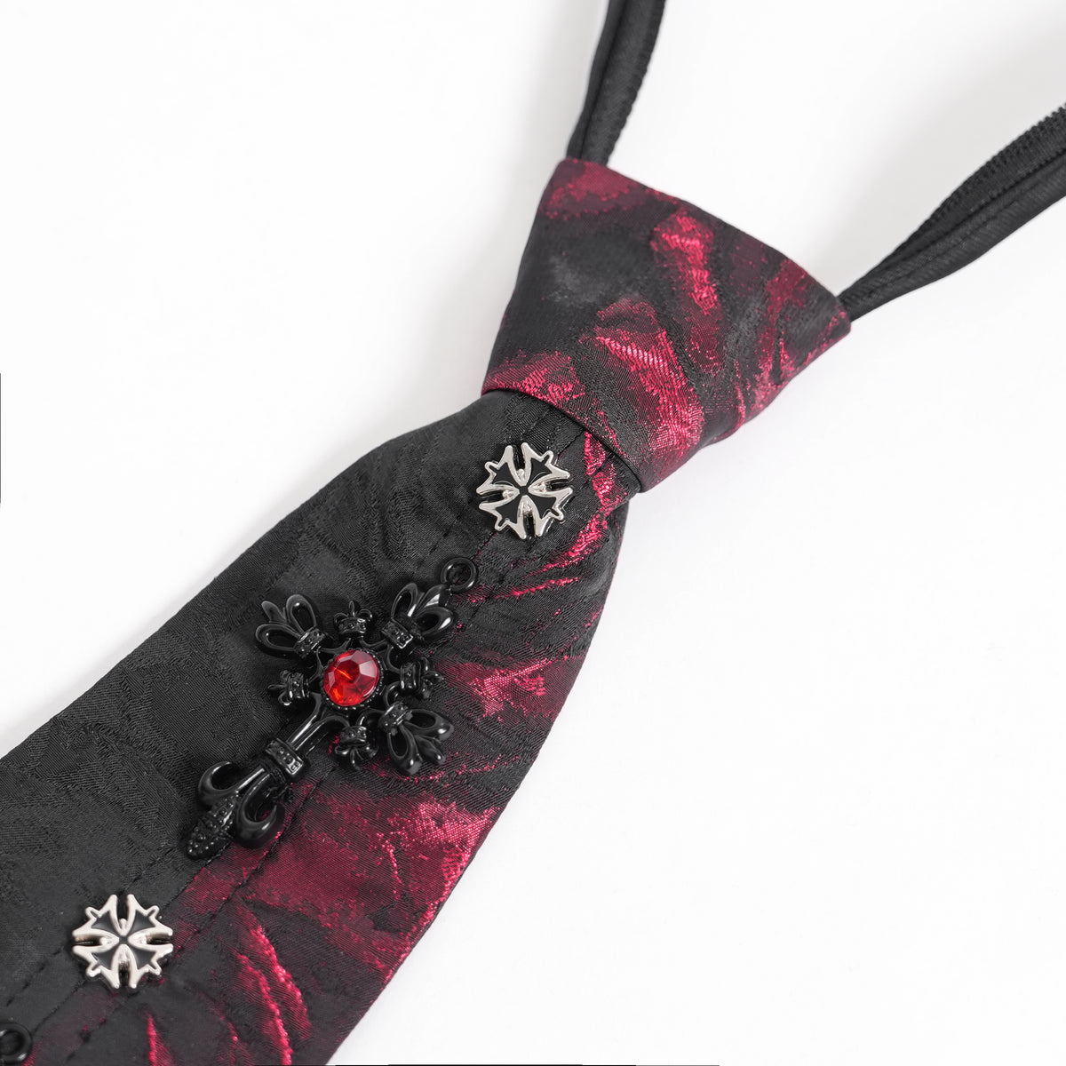 Devil Fashion AS213 gothic necktie close-up view showing a large black cross with a red stone and two small silver crosses.