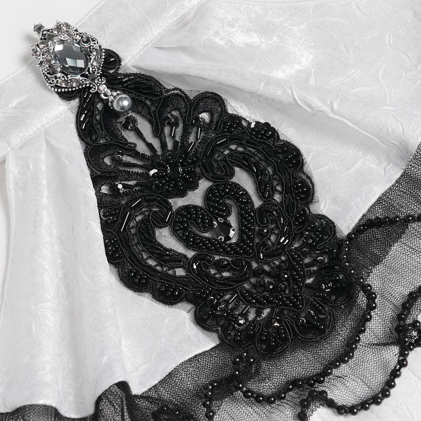 Devil Fashion AS28802 womens white and black Romantic jabot focusing on a central bead applique detail.