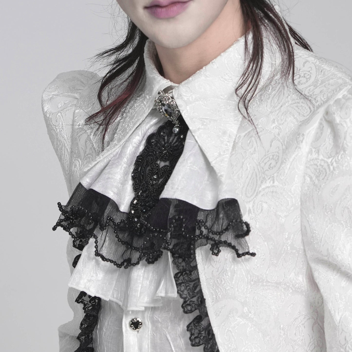 Devil Fashion AS28802 womens white and black Victorian Gothic style jabot worn by a model in a side view.