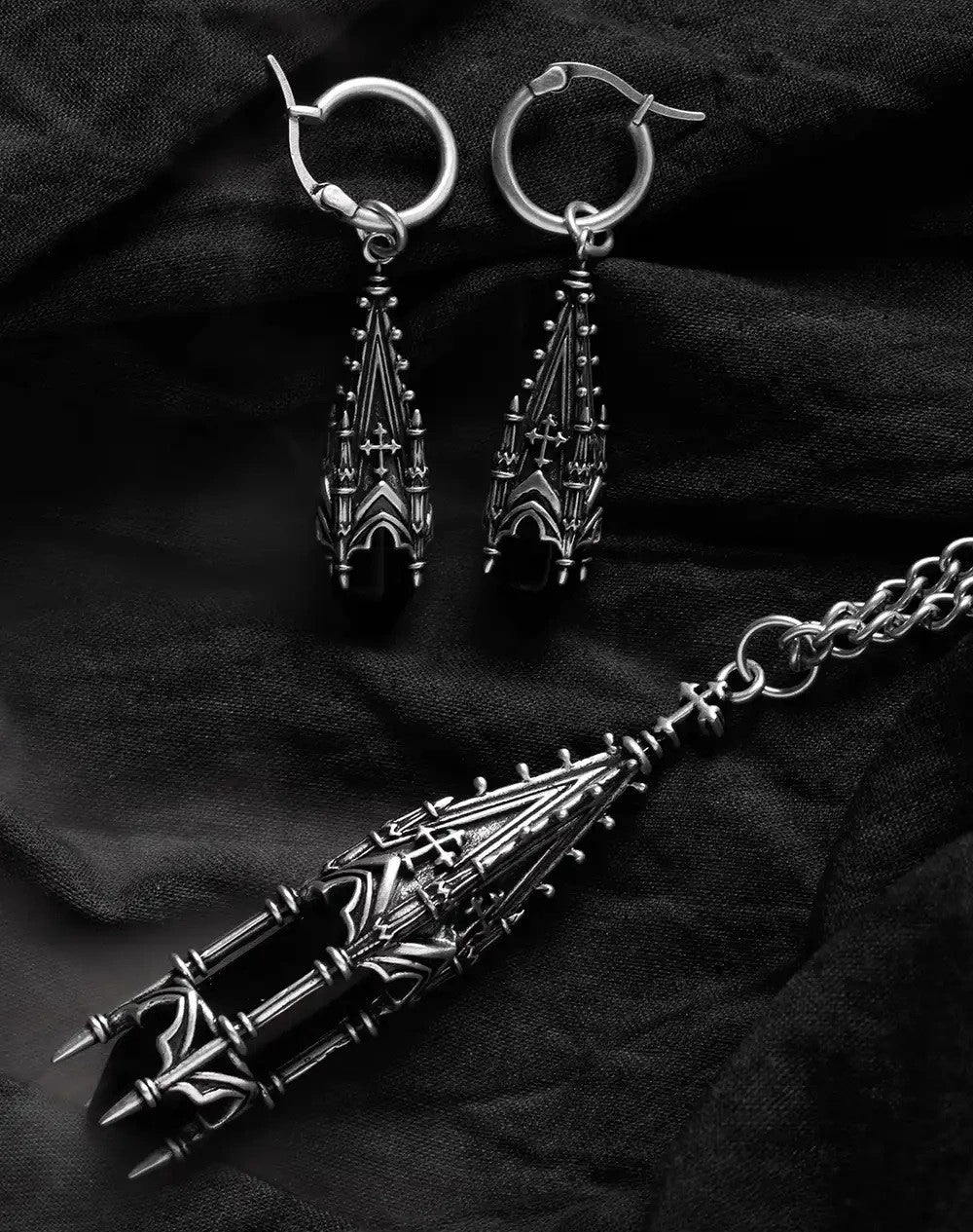 Restyle Midnight Totem gothic cathedral earrings with matching silver pendant necklace details.