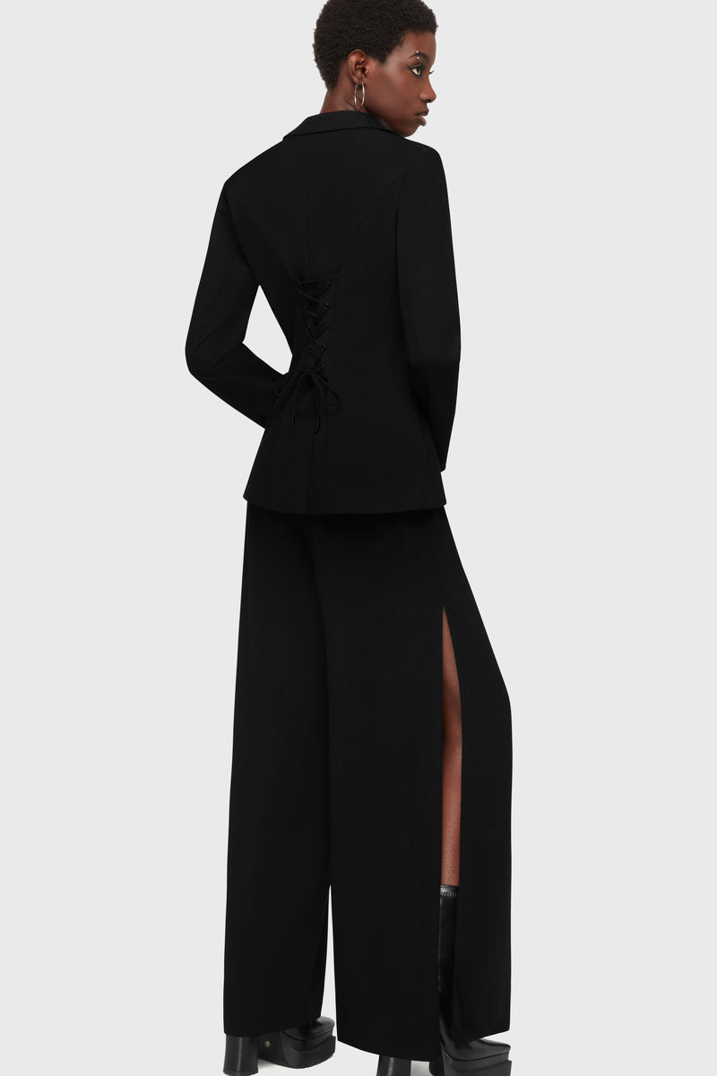 Kihilist Oblivienne corporate goth black blazer showing a full-length back view with matching side slit pants.