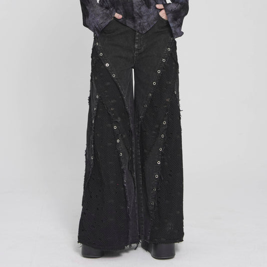 Devil Fashion PT292 black pants front view showing wide flared denim legs with ripped mesh panels in grunge style.